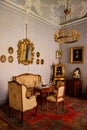 Jaromerice nad Rokytnou, Czech Republic, 06 July 2021: Castle interior with baroque wooden carved furniture, sofa and soft