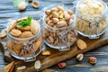 Jars with almonds,pistachios and almond flakes.