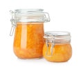 Jars of apricot jam isolated