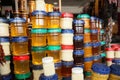 Jars with aromatic honey and different jams at market