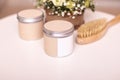 Jars with body scrub and massage brush Royalty Free Stock Photo