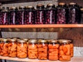 Jars of canned cherries and peaches lined in a row Royalty Free Stock Photo