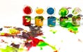 Jars with colorful paints on white background Royalty Free Stock Photo