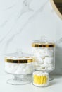 Jars with cotton balls, swabs and pads on countertop in bathroom Royalty Free Stock Photo