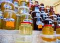 Jars with different types of honey on the counter