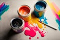 Jars with gouache paints and brushes on colorful paint splashes background AI Generated Royalty Free Stock Photo