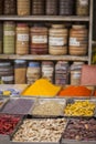 Jars of herbs and powders in a indian spice shop.