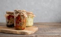 Jars of home-made fermented vegetables. Pickled, salted paprika, carrot, cauliflower and cucumbers. Place for text. Homemade Royalty Free Stock Photo