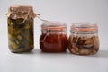 Jars of Homemade pickled vegetables: cucumbers, pickled honey agarics mushrooms. Royalty Free Stock Photo