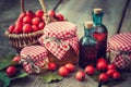 Jars of honey, tincture bottles and mortar of hawthorn berries Royalty Free Stock Photo