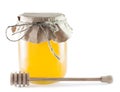 Jars of honey and wooden stick