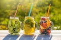 Mason jars of infused water with fruits