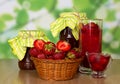 Jars of jam, strawberry in basket and glass with Royalty Free Stock Photo