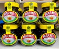 Jars of Marmite yeast extract spread in a clear plastic tray for sale in a UK supermarket