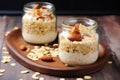 jars of oats with banana slices, almonds, side by side