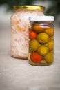 Jars of organic pickled vegetables. Marinated food.