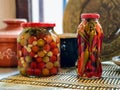 Jars of pickled peppers and tomatoes, homemade Royalty Free Stock Photo