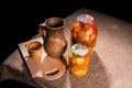 Jars of Pickles on Table with Wooden Handicrafts