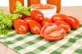 Jars of sauce with paste tomatoes and basil Royalty Free Stock Photo