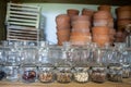 Jars of seeds on a shelf in a garden shelter