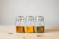 Jars with spices on light wood table. Royalty Free Stock Photo