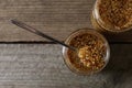 Jars and spoon of whole grain mustard on wooden table, flat lay. Space for text Royalty Free Stock Photo