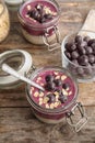 Jars with tasty acai smoothie on table Royalty Free Stock Photo