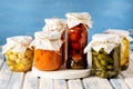 Jars of Tasty Pickled Vegetables Homemade Canned Food Blue and White Wooden Background Horizontal Harvest Royalty Free Stock Photo