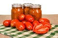 Jars of tomato sauce with paste tomatoes Royalty Free Stock Photo