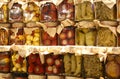 Jars of typical Italian products with zucchini, peppers, garlic