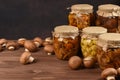 Variety of mushrooms marinated mushrooms in glass jars.