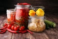 Jars with variety of pickled vegetables. Preserved food