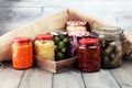 Jars with variety of pickled vegetables. Preserved food.