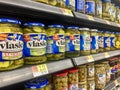 Jars of Vlasic pickles on a store shelf