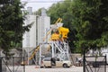 Jaslo, Poland - may 25 2018: Workers repair the aggregate for the production of concrete. Manufacturing technology of building mix