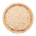 Jasmine brown rice in wooden bowl isolated on white. Top view Royalty Free Stock Photo