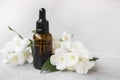 Jasmine essential oil. Bottle of jasmine aromatherapy oil with j Royalty Free Stock Photo