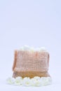 Jasmine flower in burlap bag on white background,select focus. Royalty Free Stock Photo