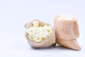 Jasmine flower in burlap bag on white background,select focus. Royalty Free Stock Photo