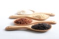 Jasmine rice, jasmine brown rice, jasmine red rice, purple-brown rice in wooden ladle. Royalty Free Stock Photo