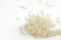 Jasmine rice on a wooden spoon isolated on a white background Royalty Free Stock Photo