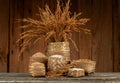 Jasmine rices,rice bran ,paddy and ear of rice on an old wood background Royalty Free Stock Photo