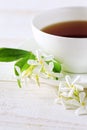 Jasmine tea in a white bone china cup on white background Royalty Free Stock Photo