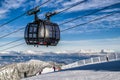 Skiers on the slope. Cableway Funitel in Low Tatras mountains, S