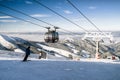 Skiers on the slope. Cableway Funitel in Low Tatras mountains, S