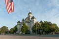 Jasper County Courthouse street viewof castle style architecture with American flag in Carthage Missouri, USA