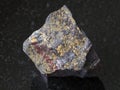 jaspilite (ferruginous quartzite) stone on dark