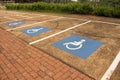 Jau / Sao Paulo / Brazil - 02 21 2020: Disability parking spots on concrete. Several blue and white signs painted at the floor