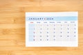 Jauary 2024 calendar page on wooden background Royalty Free Stock Photo