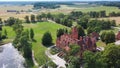 Jaunmoku Brick Medieval Castle Near Tukums, Latvia at Pond in Clear Sunny Summer Day From Above Top View.